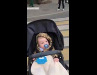 Group girls bikini hold bucket street baby