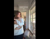 Cat squirming from being held 