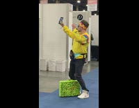 Guy in yellow with headband vlogs fun dip