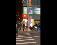 Pink inflatable unicorn dances on metal pole