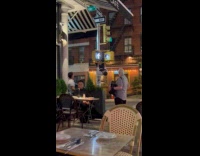 Restaurant server does pullups at signal light