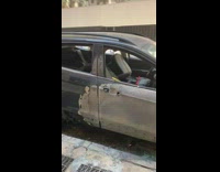 Burned ford SUV parked on the street