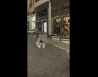 Woman in patterned outfit on the street