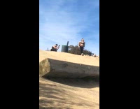 Girl takes photo on top of hiking trail