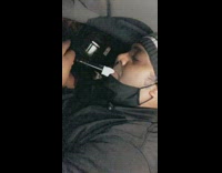 Grey beanie guy plays clarinet recorder car