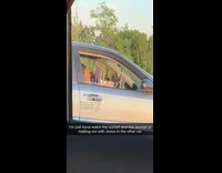 Lady in car kisses picture of jesus