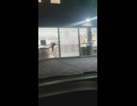 Two girls dance in market