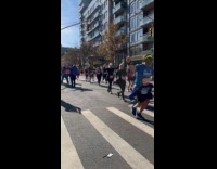Runners dance and sing YMCA during marathon