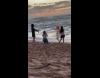 Woman in dress dance shoot at beach