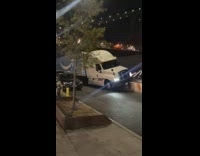 Amazon prime truck climbs over concrete barrier