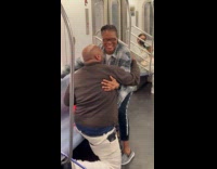 Man proposes to woman inside subway train
