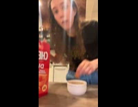 Cat eats mouth full of cheez its