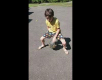 Boy yellow shirt dribble ball between legs