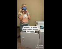 Woman wears dirty mask on car floor