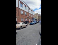 Woman splash water to man holding boombox