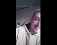 Guy with squirrel on shoulder after bath 