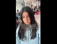 Tired Lady Pans Camera Up in Airport