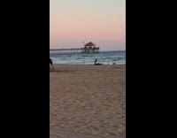 Couple Watches Surfer Model Stand in Place