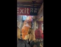 Collab Subway Creatures - Inflatable dinosaur costume climb up stairs subway