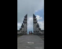 Two women jump between pillars