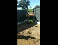 Guy jumps over bin between two tanks