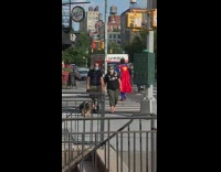 Guy blue superman costume red cape crosswalk 