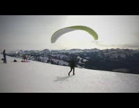 Two guys red and green parachutes