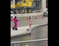 Women pink suit picture construction crane