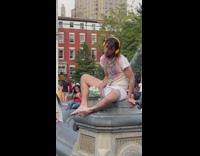 Guy cry while on photoshoot at the park on fountain 