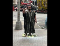 Man on Flowers Spills Milk on Ground