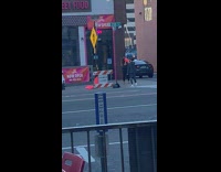 White boots girl holds flag poses street