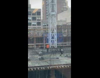 Shirtless man dances provocatively at construction site