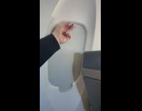 Airplane window shade broken and slides back down 