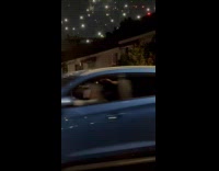 Woman dances while controls traffic on street