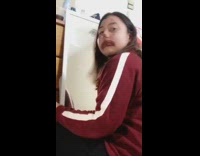 Girl does clown makeup white mirror bedroom