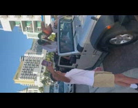 Guy joker makeup sit scream over jeep