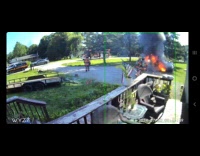 Car gas tank blows up near firemen