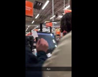 Man play minecraft on hardware store computer