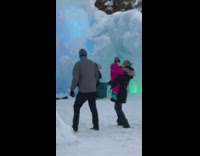 Woman teal dress sit ice castle bench