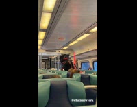 Man wearing cyberpunk costume on train