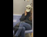 Cross eyed girl wear white mask on subway train