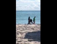 Woman silver onesie swimsuit twerk dance beach