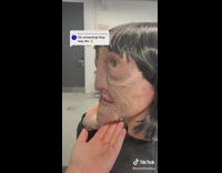 Person under distorted face mask that looks realistic in black sweater