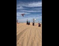 Collab SendItOfficiall - Man motorcycle jump near helicopter at desert