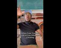 Teacher looks at guy while he cheats 