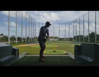 Man swings and hit the golf ball with tee spins