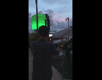 Guy two phones video night lounge