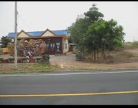 Man sells a lot of chair on motorcycle
