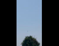 Man shows person paramotor gliding at night