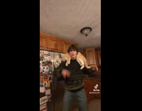 Collab ClipsIG - Cat Lays Around Mans Shoulder as he Sings